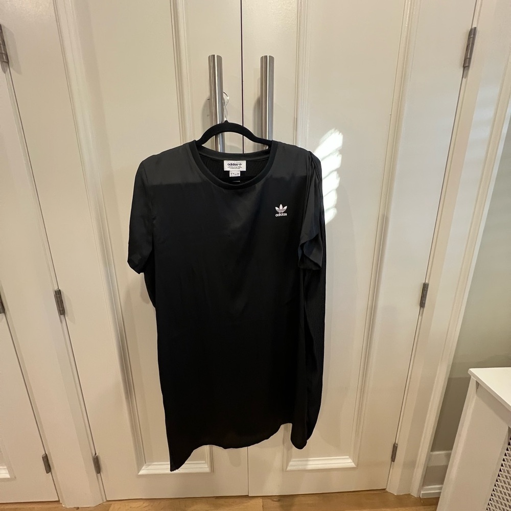 Adidas athletic style dress with pleated back panel. Like new